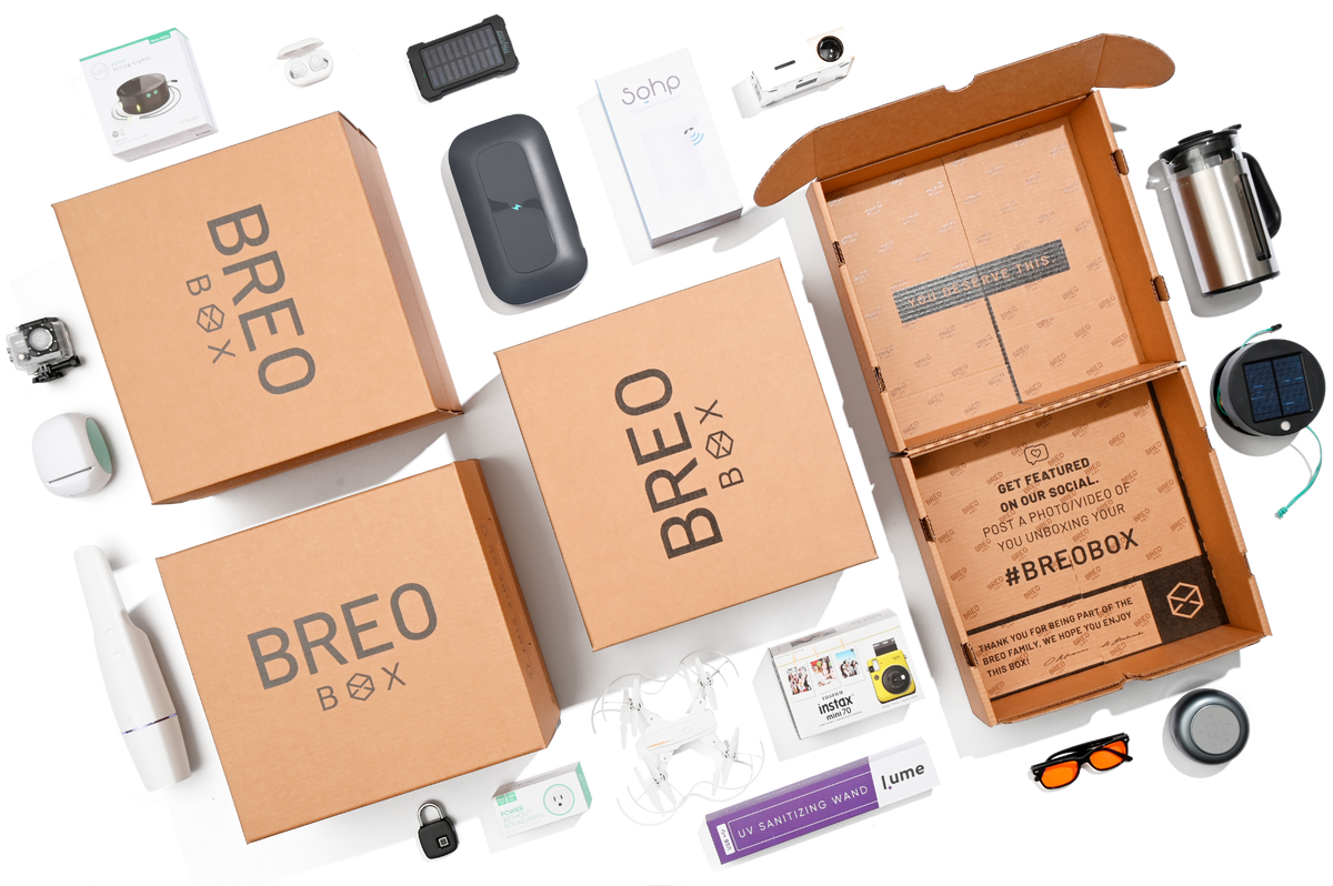 Four BREO BOX boxes surrounded by products from past boxes
