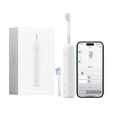 White electric toothbrush with packaging, brush head, and smartphone app on a white background