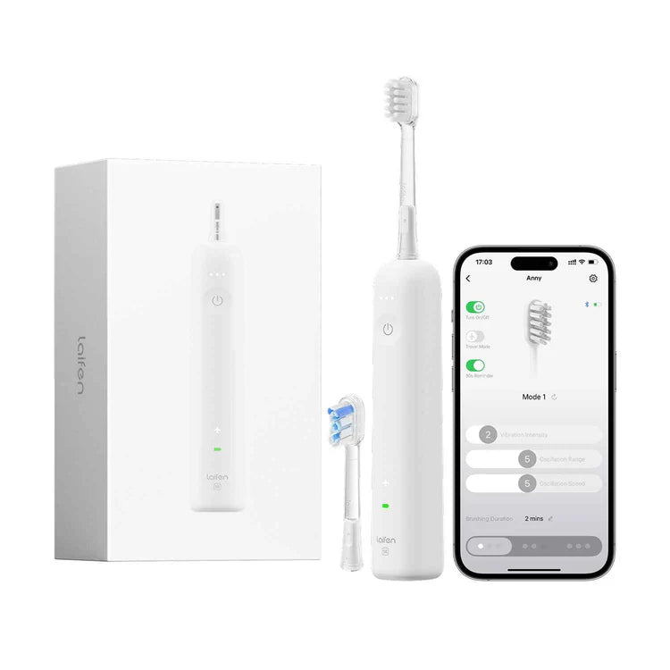 White electric toothbrush with packaging, brush head, and smartphone app on a white background