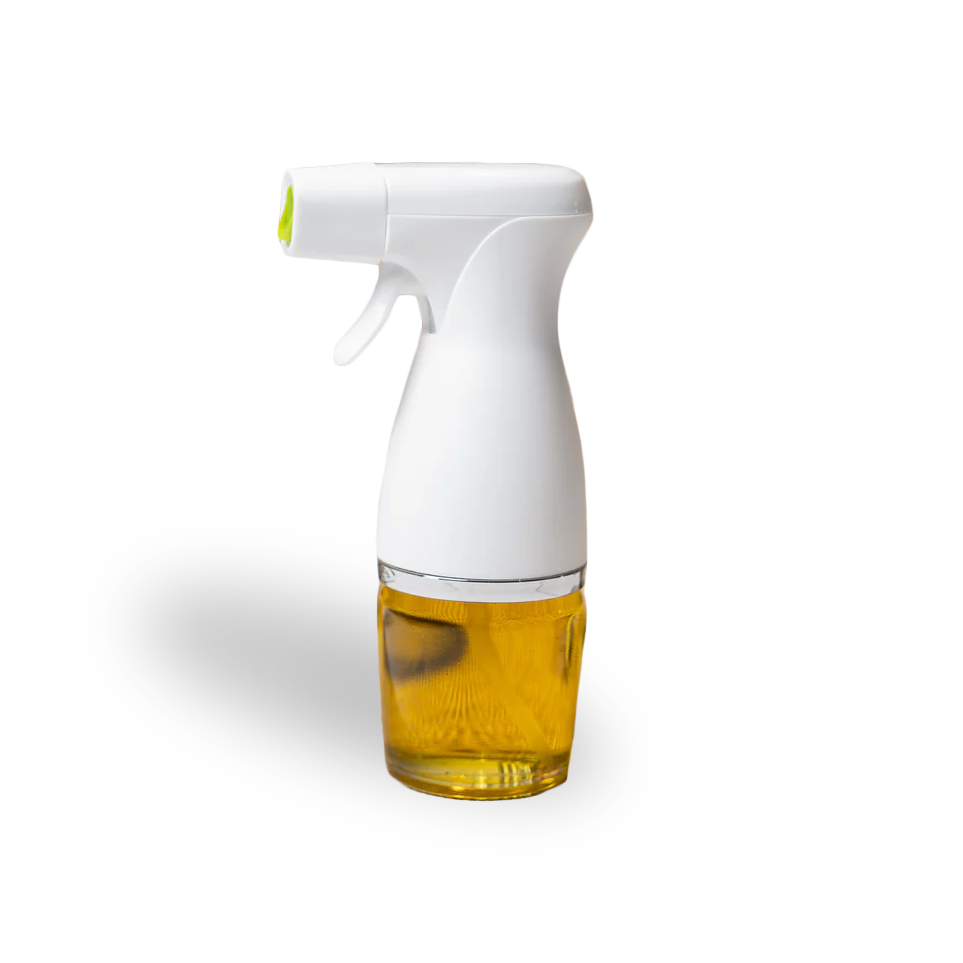 Spray bottle with white nozzle and glass container filled with oil on a white background