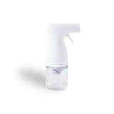 Clear glass bottle with white cap on a white background
