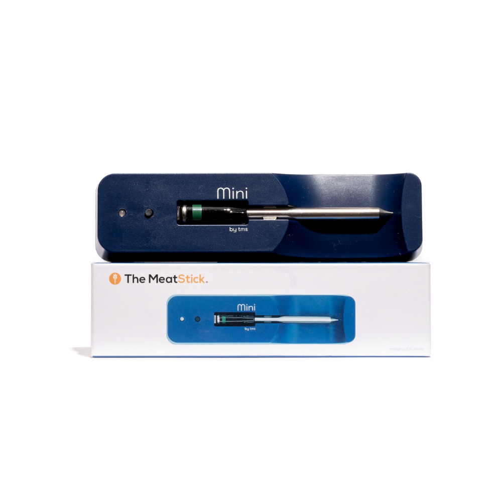 The MeatStick Mini probe thermometer in its blue and white packaging, with the device visible through a clear plastic window.