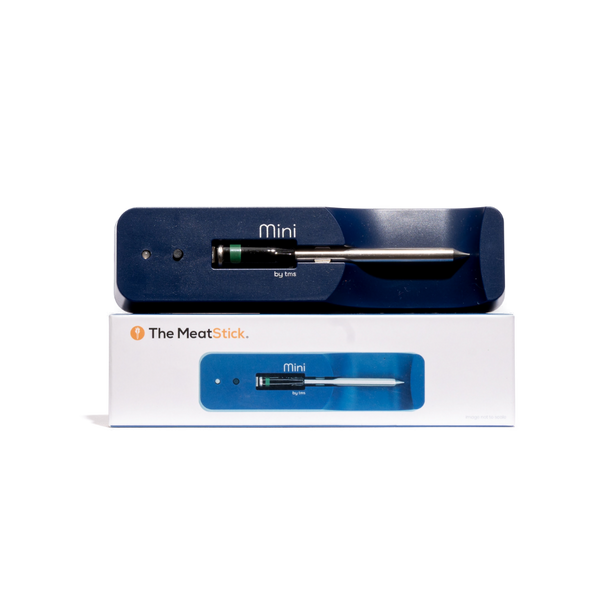 The MeatStick Mini probe thermometer in its blue and white packaging, with the device visible through a clear plastic window.